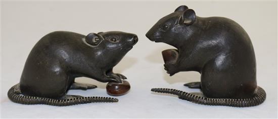 Two Japanese two-colour bronze models of a rat holding a nut, 19th century, length 9cm and 9.5cm